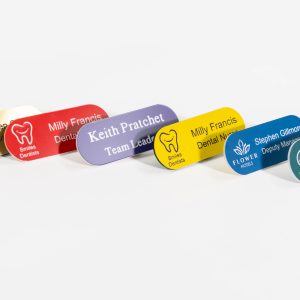 An assortment of acrylic engraved name badges in a range of vibrant colours. These badges are made from durable acrylic material with sounded corners