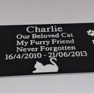 Close-up of a 4" x 2" Pet Memorial Engraved Dog Plaque with Paw Prints.