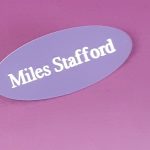 Engraved purple oval name badge, engraved with white text.