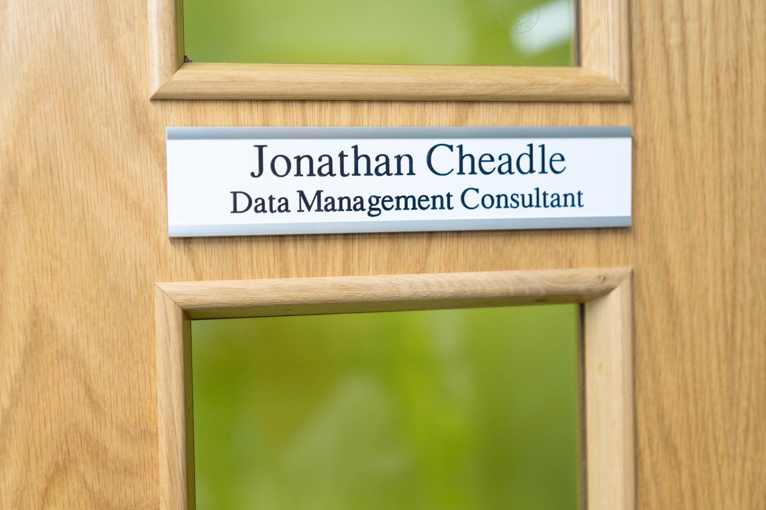 Image featuring a 10" x 2" interchangeable aluminum office door sign, sleek and modern