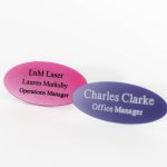Oval-shaped acrylic engraved name badges in a range of vibrant colours. These badges are made from durable acrylic material