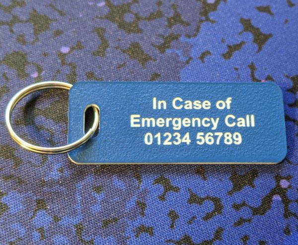 Vibrant blue emergency tag with essential medical information for swift and informed response.