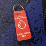 Red emergency tag, discreetly conveying critical medical information for effective emergency response