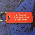 Bright red emergency tag indicating medical conditions for quick identification and assistance.