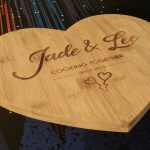 Custom bamboo chopping board with 'Jade & Lee Cooking Together Since 2019' etching and two adorable love hearts.