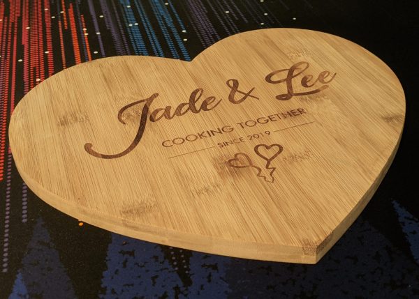 Custom bamboo chopping board with 'Jade & Lee Cooking Together Since 2019' etching and two adorable love hearts.