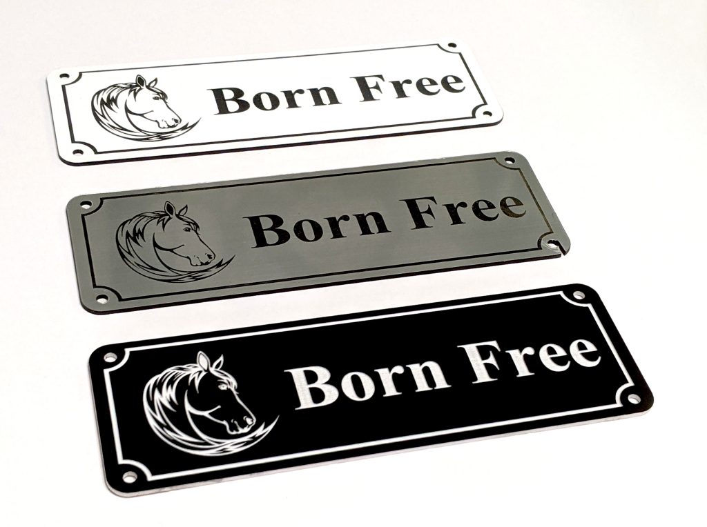 Personalised Stable Name Plaques - 6" x 2" with decorative border, engraving of a Horse's Head on the Left-Hand side with contrasting name in the centre of the plaque, 4 screw holes in each corner.