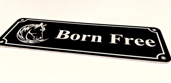 Close up of white Engraving on black Stable Name Plaque - 6" x 2" with Left-Hand Horse's Head Design