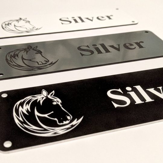 Personalised Stable Name Plaques - 6" x 2" with decorative border, engraving of a Horse's Head on the Left-Hand side with contrasting name in the centre of the plaque, 4 screw holes in each corner.