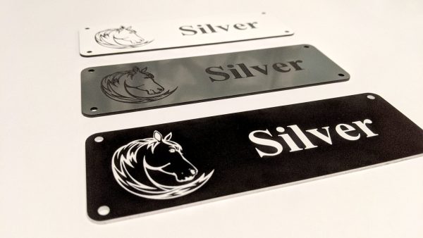 Personalised Stable Name Plaques - 6" x 2" with decorative border, engraving of a Horse's Head on the Left-Hand side with contrasting name in the centre of the plaque, 4 screw holes in each corner.