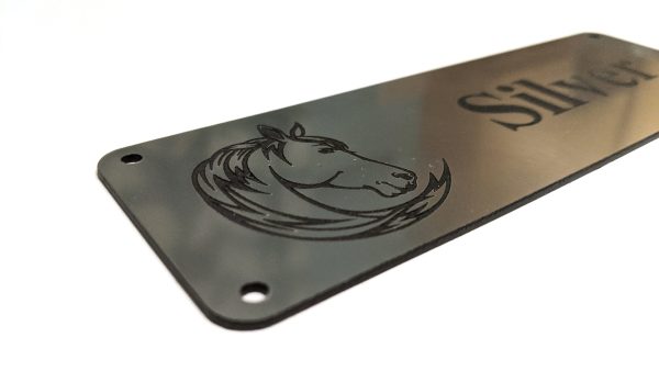 Close up of black engraving on silver Stable Name Plaque - 6" x 2" with Left-Hand Horse's Head Design