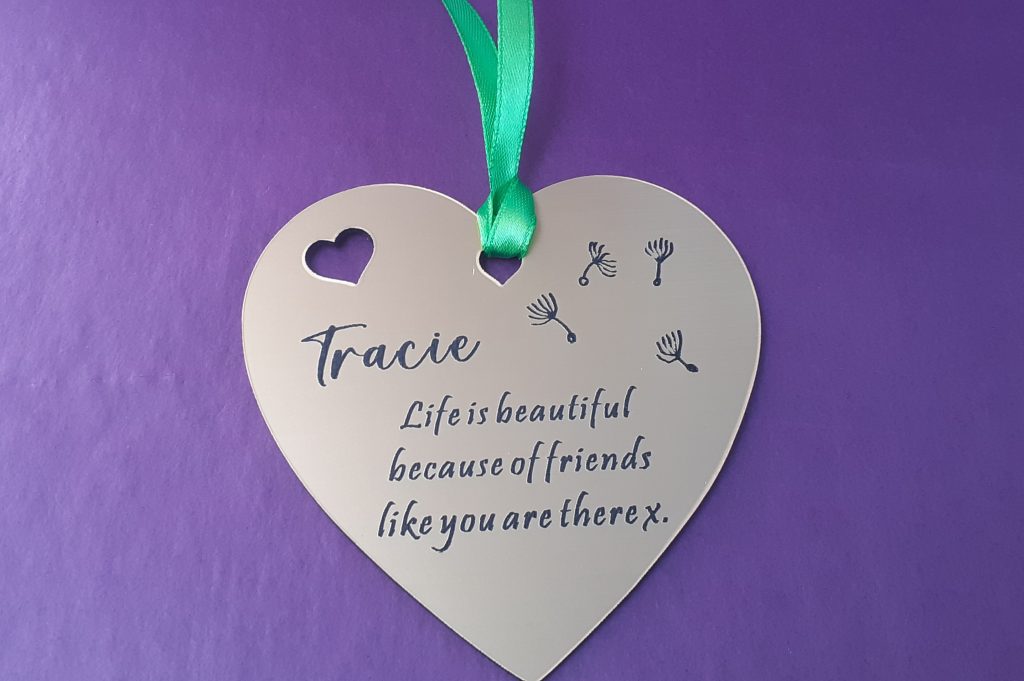 Charming heart-shaped acrylic plaque with your custom message for gift bags