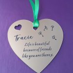 Charming heart-shaped acrylic plaque with your custom message for gift bags