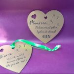 Personalized acrylic heart plaque, crafted for use as a unique gift bag tag