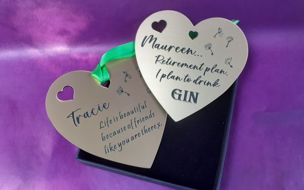 Heart-shaped acrylic plaque with custom engraving, designed as a special gift bag tag