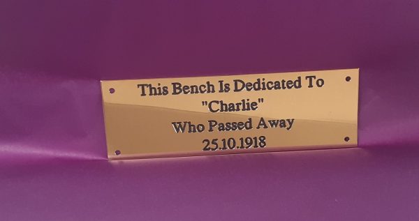 Classic brass bench plaque design, engraved with precision and enhanced by black paint infill, secured with four reliable screw holes