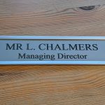 Sophisticated office door signage - 10" x 2" aluminum sign in modern holders, perfect for a professional setting