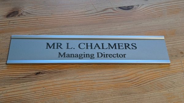 Sophisticated office door signage - 10" x 2" aluminum sign in modern holders, perfect for a professional setting