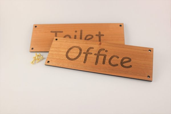 6 inch by 2 inch personalised wooden door signs with screw holes and brass screws scaled