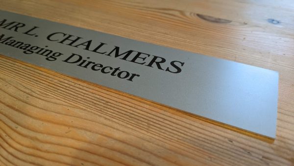 Make a statement with this sleek 10" x 2" aluminum office door sign, a perfect fit for any professional setting