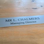 Impress clients and colleagues with a refined 10" x 2" aluminum office door sign, designed for modern workplaces