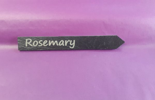 Personalised slate plant markers with custom engraving showing Rosemary