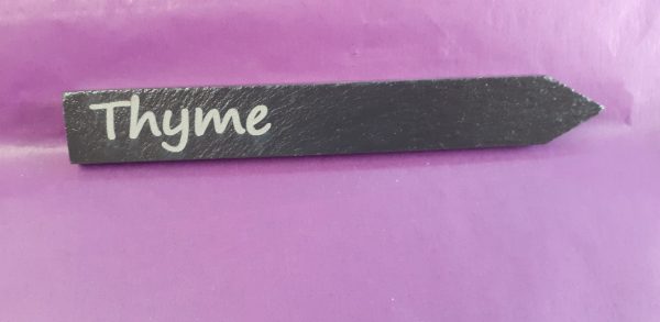Personalised slate plant markers with custom engraving showing Thyme