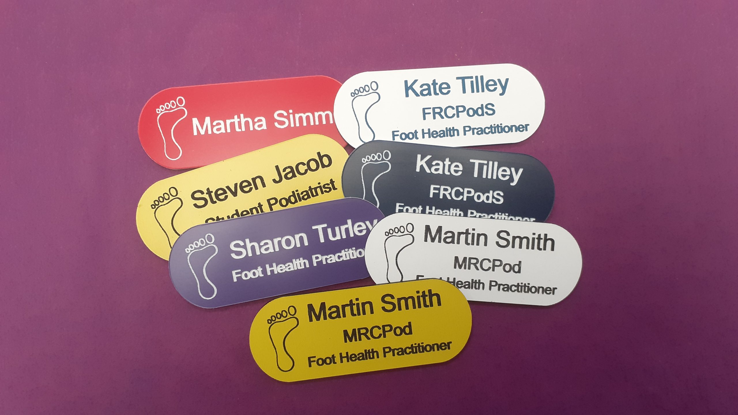 name badges in the shape of a pill
