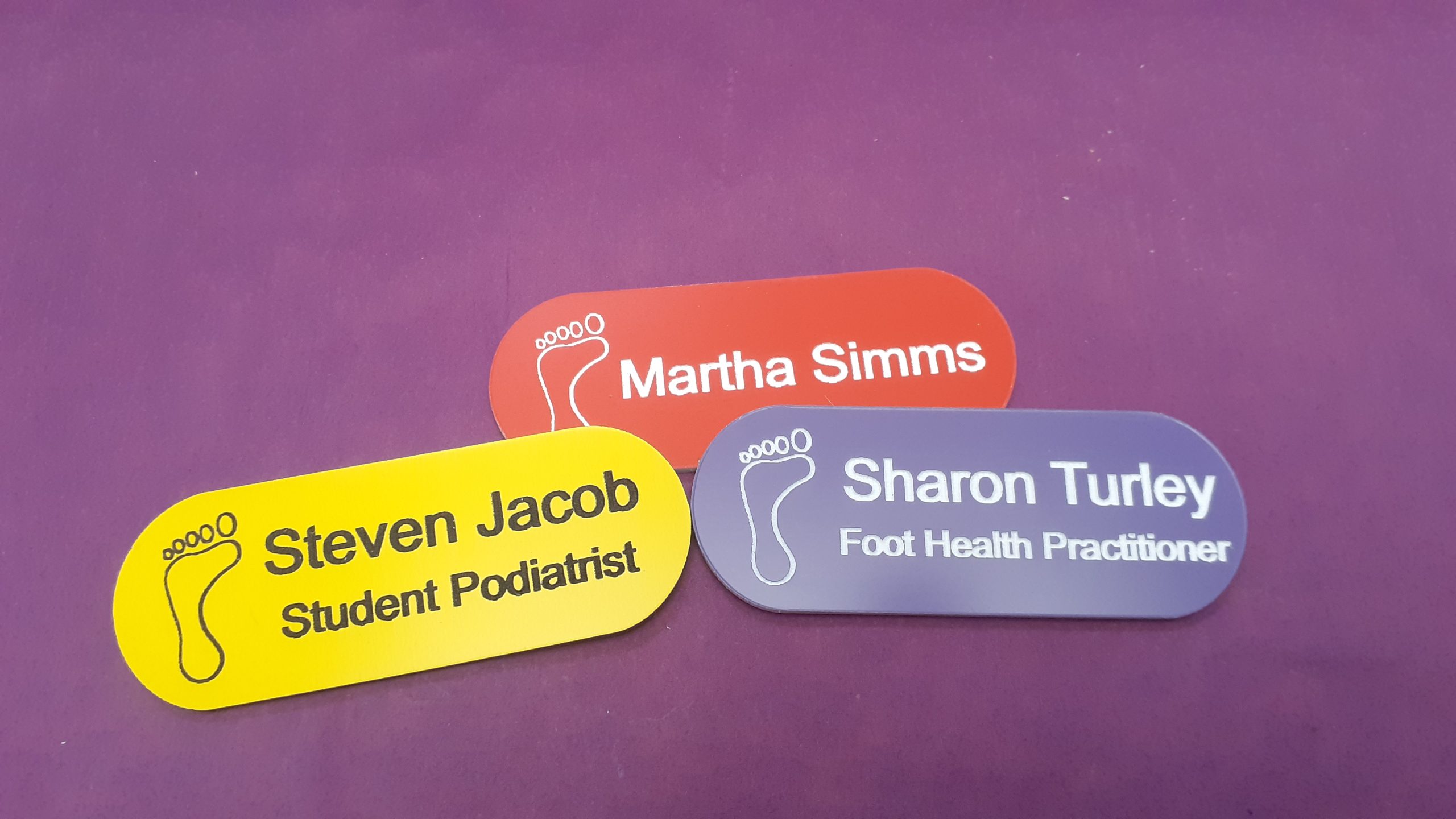 name badges in the shape of a pill