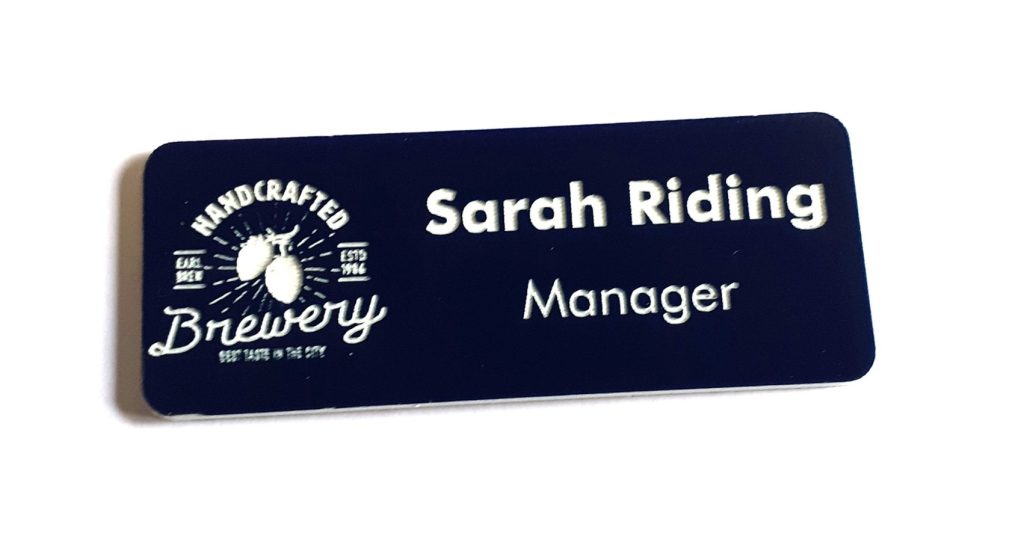 Logo engraving on badge with detailed hops and company name.