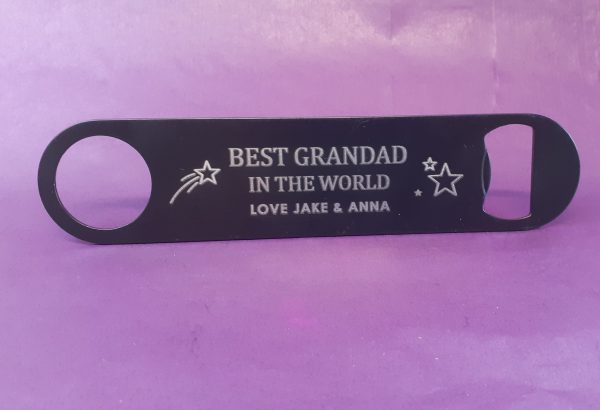 Stainless Steel Bar Blade Bottle Opener with laser engraved text, showing the title best grandad and a person name