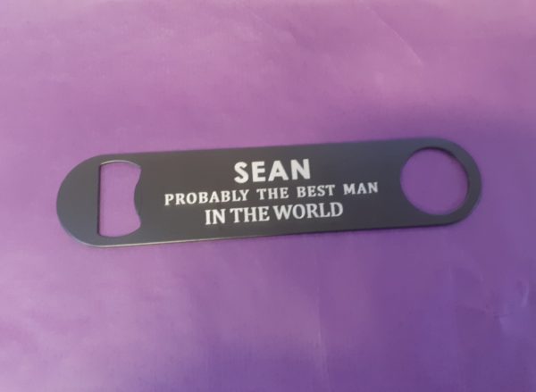 Stainless steel Bar Blade Bottle Opener with laser engraved text, showing the best man and a person name