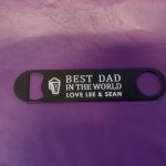 Stainless Steel Bar Blade Bottle Opener with laser engraved text, showing the title best dad and a person name