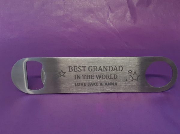 Stainless Steel Bar Blade Bottle Opener with laser engraved text, showing the title best grandad and a person name