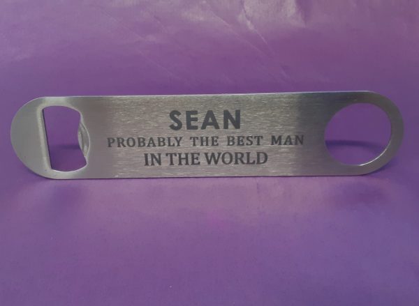 Stainless steel Bar Blade Bottle Opener with laser engraved text, showing the best man and a person name