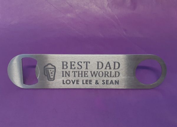 Stainless Steel Bar Blade Bottle Opener with laser engraved text, showing the title best dad and a person name