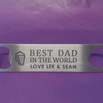 Stainless Steel Bar Blade Bottle Opener with laser engraved text, showing the title best dad and a person name