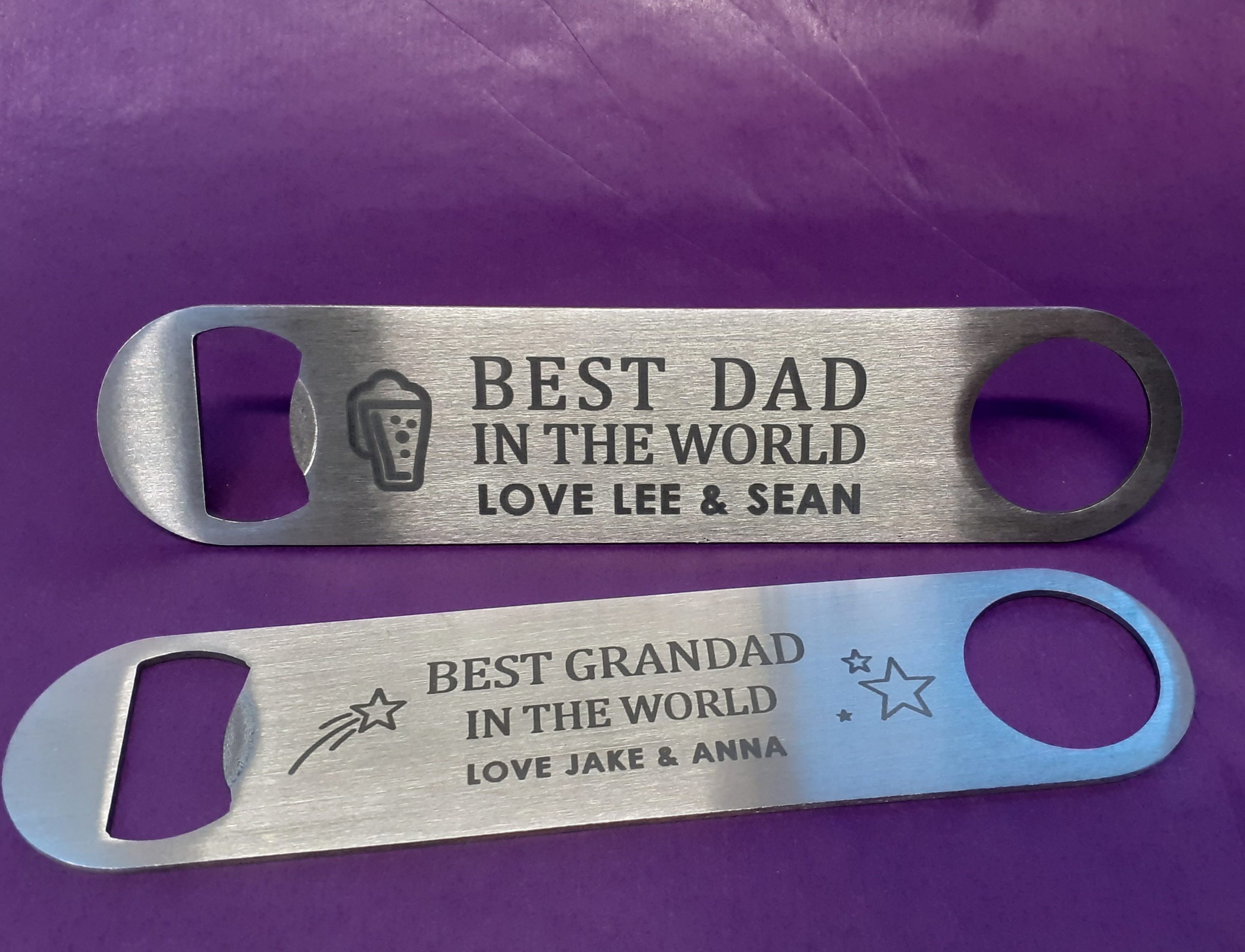 Two High-quality stainless steel bar blade bottle openers with a sleek design and custom engraving, ideal for various occasions.