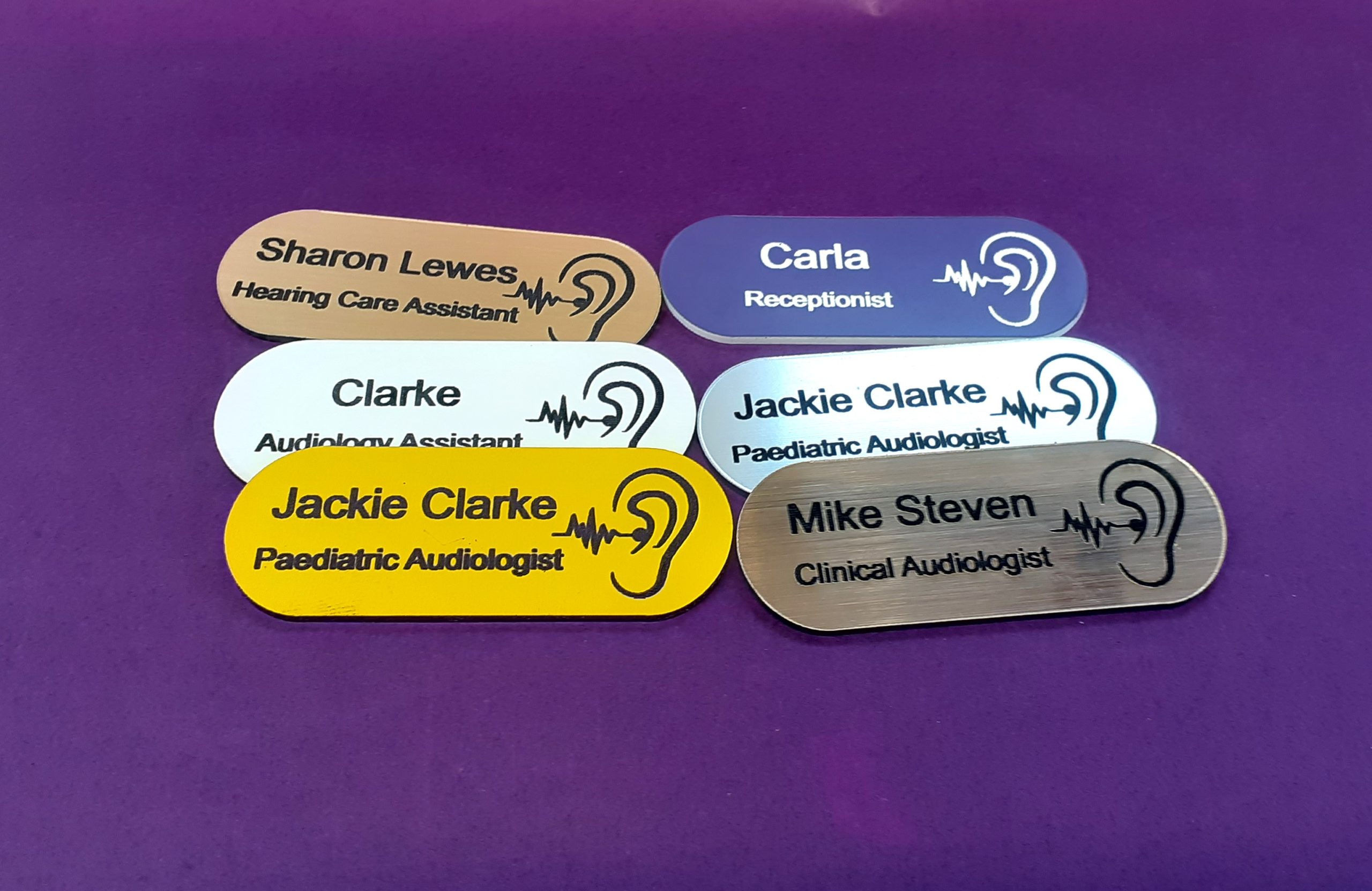 The hearing aid logo makes them suitable for Audio professionals or health-related events. The pill-shaped design and colourful variations contribute to a visually appealing and customisable identification solution.