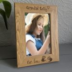 Personalised Engraved 6" x 4" Photo Frames, An oak veneer photograph frame. It has been personalised with text etched on the frame showing a picture of a girl