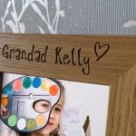 Personalised Engraved 4"x6" Photo Frames, An oak veneer photograph frame. It has been personalised with text etched on the frame showing a picture of a girl